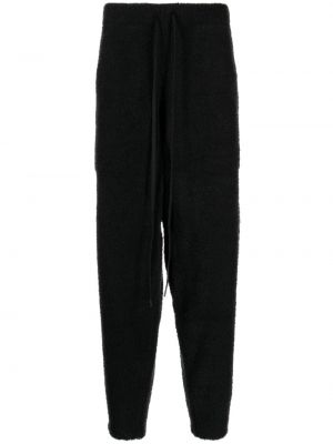 Fleecové teplákové nohavice s potlačou Mastermind World čierna