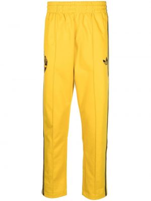 Teplákové nohavice Adidas žltá