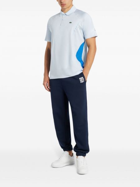 Pantalon brodé avec imprimé slogan Lacoste bleu