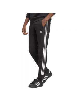 Czarne spodnie sportowe w paski Adidas