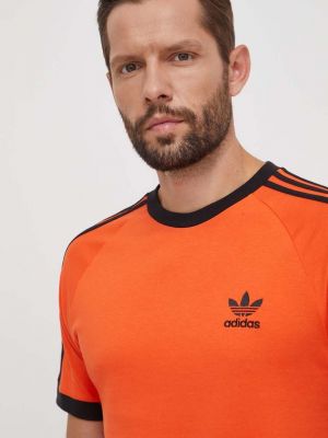 Памучна тениска с дълъг ръкав с апликация Adidas Originals оранжево