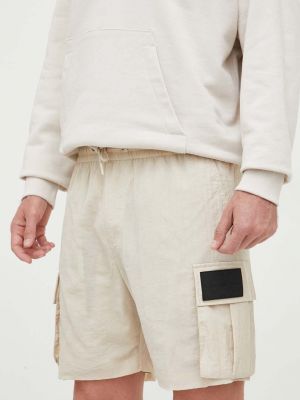 Szorty jeansowe z poliestru wsuwane z kieszeniami Calvin Klein Jeans - beżowy