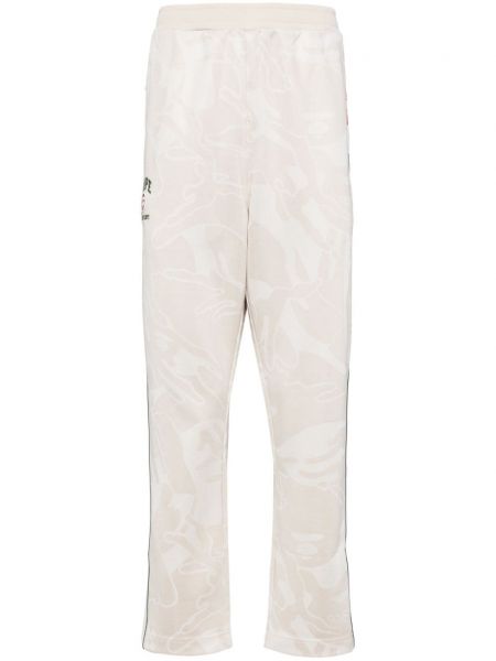 Žakárové teplákové nohavice s výšivkou Aape By *a Bathing Ape® biela