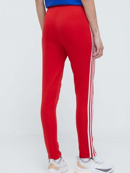 Sportovní kalhoty s aplikacemi Adidas Originals červené