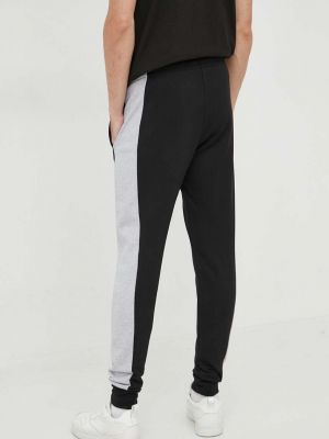 Bavlněné sportovní kalhoty Lacoste černé