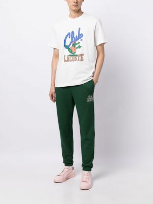 Bavlněné sportovní kalhoty s potiskem Lacoste zelené