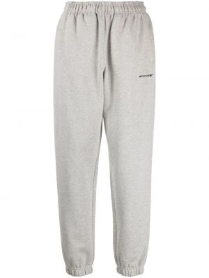 Jednobarevné bavlněné sportovní kalhoty s potiskem Monochrome šedé