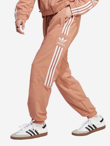 Spodnie sportowe z nadrukiem Adidas Originals brązowe