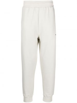 Bavlnené teplákové nohavice s potlačou A-cold-wall* biela
