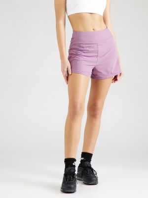 Teplákové nohavice Nike fialová