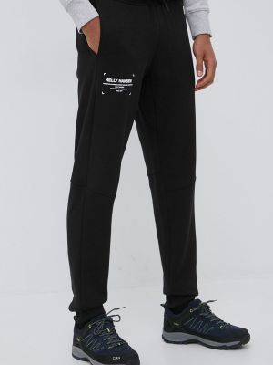 Sportovní kalhoty s potiskem Helly Hansen černé