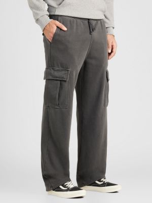 Teplákové nohavice Weekday sivá