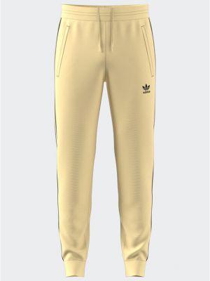 Прилепнали спортни панталони на райета Adidas жълто