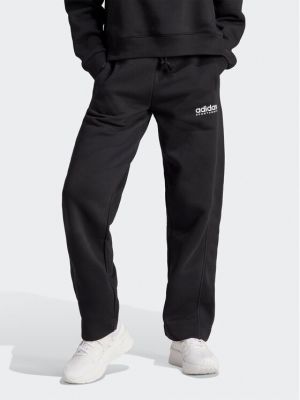Pantaloni sport din fleece cu croială lejeră Adidas negru