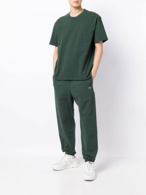 Spodnie sportowe bawełniane z nadrukiem Suicoke zielone