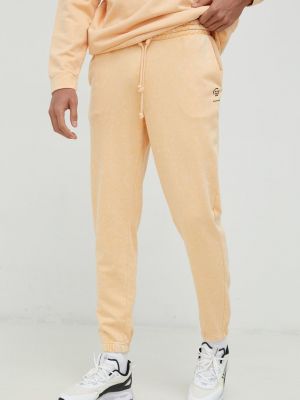 Outhorn spodnie dresowe męskie kolor pomarańczowy z aplikacją