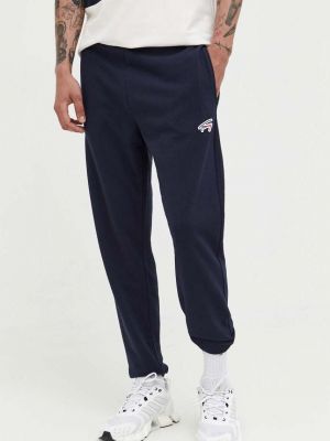 Sportovní kalhoty s aplikacemi Tommy Jeans béžové