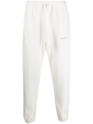 Bílé bavlněné sportovní kalhoty s potiskem Ih Nom Uh Nit