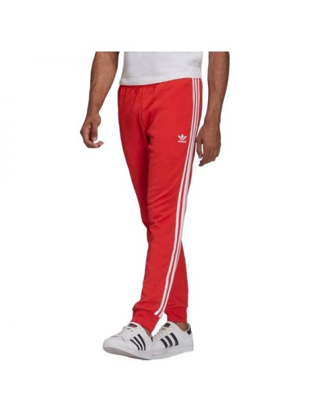 Спортивные штаны в полоску Adidas красные