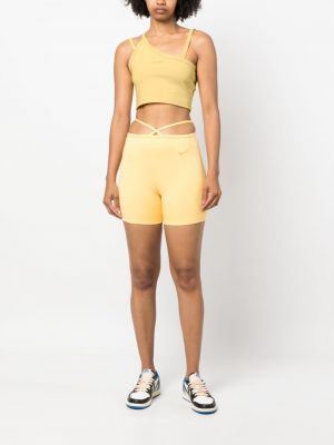 Tank top asymetryczny Nike żółty