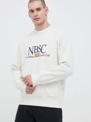 Бавовняний светр з принтом New Balance бежевий