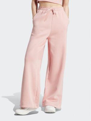 Sportovní kalhoty relaxed fit Adidas růžové
