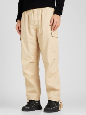 Pantaloni cu buzunare Calvin Klein Jeans bej