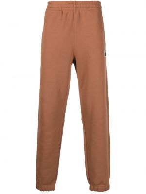 Pantalon de joggings en coton à imprimé Lacoste marron