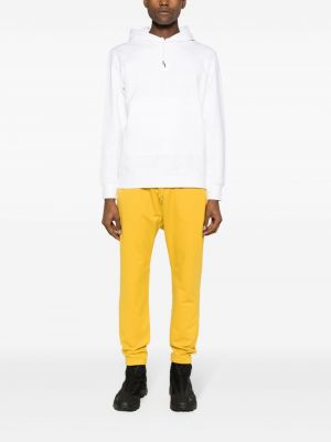 Bavlněné kalhoty s potiskem C.p. Company žluté