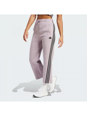 Pruhované slim fit priliehavé teplákové nohavice Adidas