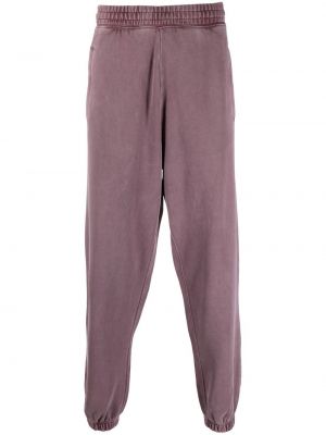 Bavlnené nohavice s vreckami Carhartt Wip - fialová