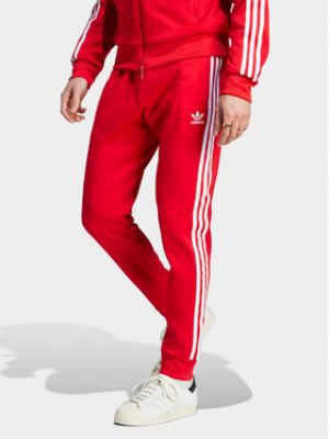 Slim fit sportovní kalhoty s aplikacemi Adidas Originals červené
