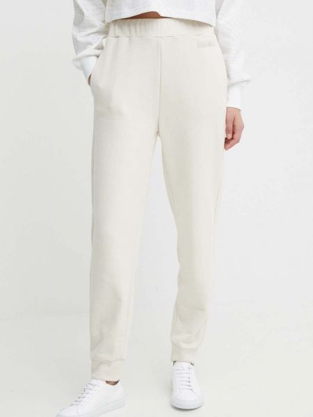 Beżowe spodnie sportowe Calvin Klein