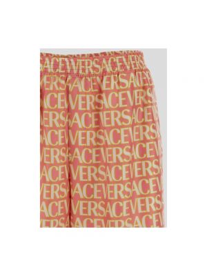 Pantalones cortos de seda Versace naranja