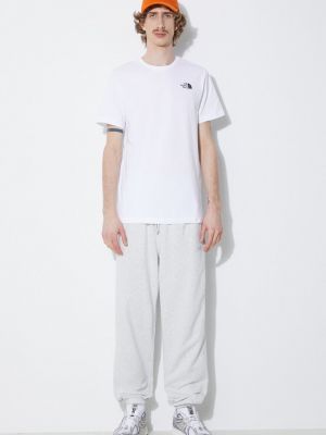 Bavlněné sportovní kalhoty s aplikacemi New Balance šedé