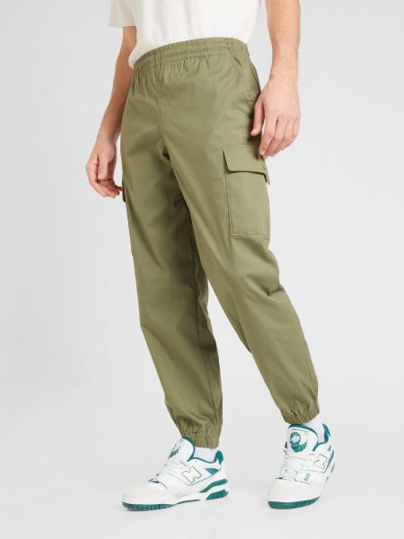 Pantaloni cu buzunare New Balance verde