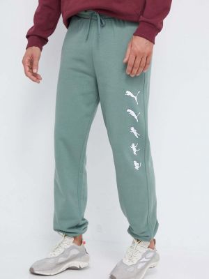 Памучни панталон Puma зелено