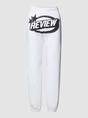 Spodnie sportowe z nadrukiem Review Female białe