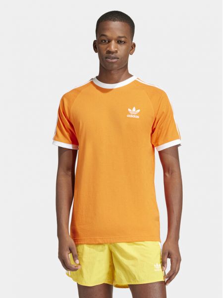 Pruhované bavlněné slim fit tričko Adidas oranžové