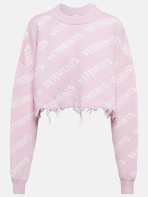 Sweter wełniany z przetarciami Vetements różowy