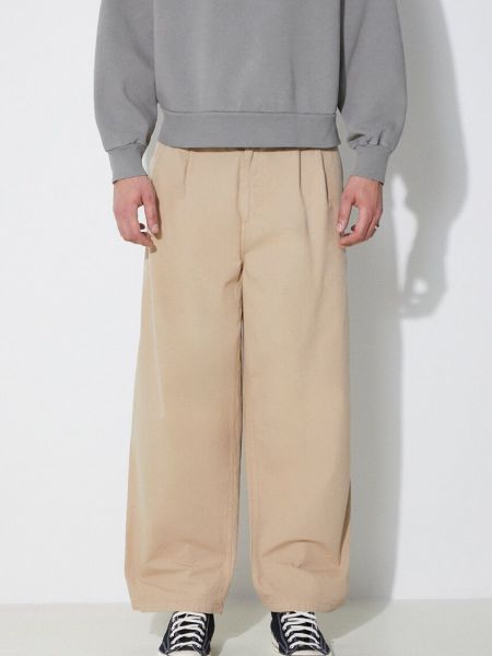 Jednobarevné bavlněné kalhoty Carhartt Wip béžové
