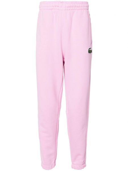 Spodnie sportowe bawełniane Lacoste różowe