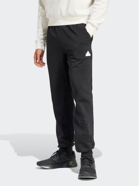 Priliehavé teplákové nohavice s potlačou Adidas čierna