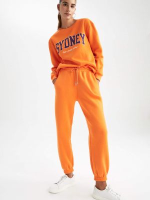 Teplákové nohavice Defacto oranžová
