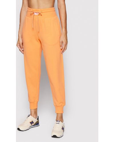 Voľné priliehavé teplákové nohavice New Balance oranžová