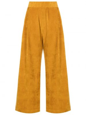 Voľné zamatové nohavice Osklen žltá