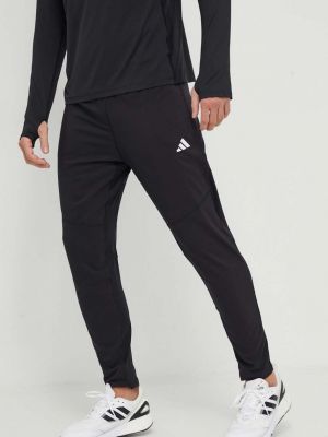 Czarne spodnie sportowe z nadrukiem Adidas Performance
