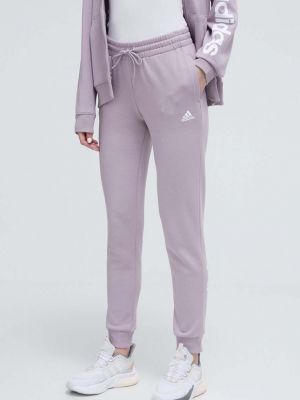 Spodnie sportowe bawełniane z nadrukiem Adidas różowe