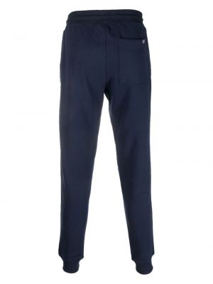 Haftowane spodnie sportowe bawełniane Tommy Jeans niebieskie
