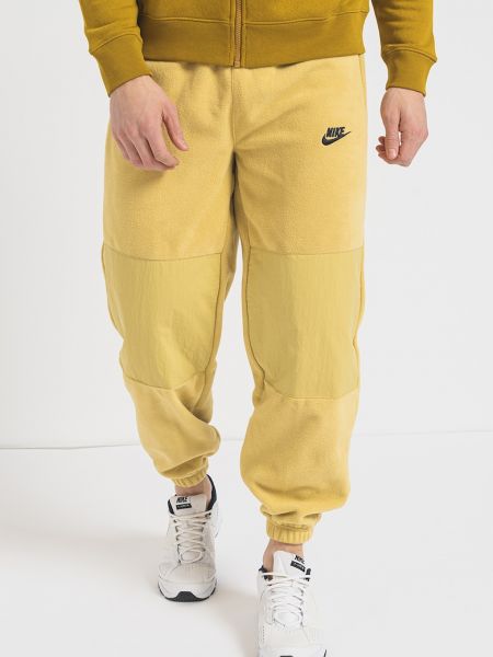 Спортивные штаны с карманами Nike желтые